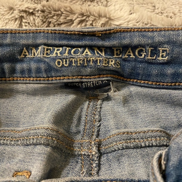 American Eagle | High Rise Super Stretch Skinny Distressed Light Blue Jeans - Picture 6 of 7